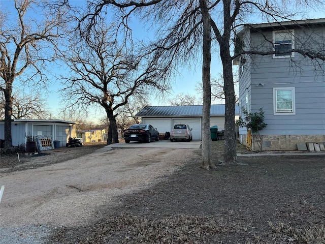 view of side of home featuring a garage