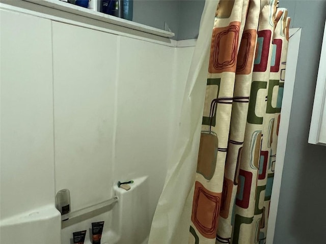 interior space with a shower with shower curtain