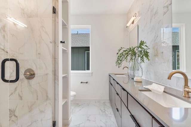 full bathroom featuring marble finish floor, a sink, a marble finish shower, and toilet