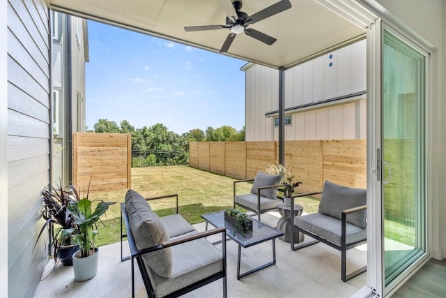 view of patio featuring a fenced backyard, ceiling fan, and an outdoor living space