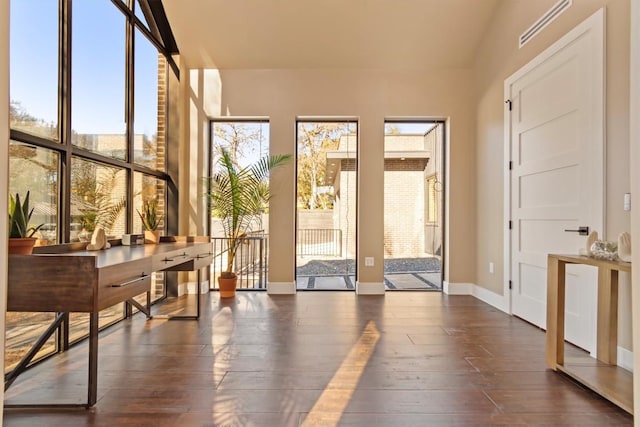 sunroom / solarium featuring a healthy amount of sunlight