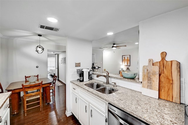 3840 Far W Blvd Unit 101, Austin, TX 78731 - kitchen featuring sink, white cabinetry, light stone counters, hanging light fixtures, and dark hardwood / wood-style floors