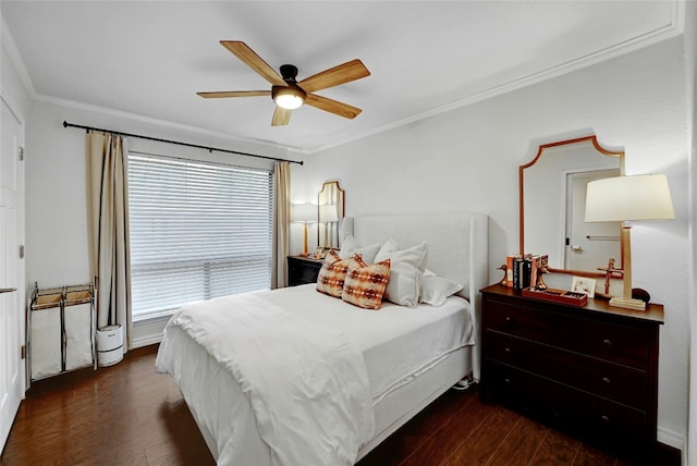 bedroom featuring ceiling fan, ornamental molding, and dark hardwood / wood-style flooring