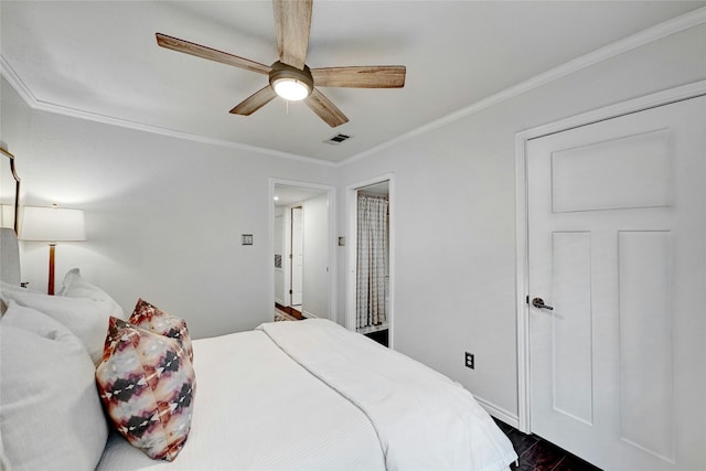 bedroom featuring ceiling fan, ornamental molding, and dark hardwood / wood-style flooring