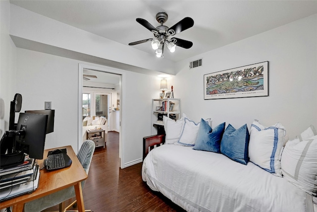 bedroom with dark hardwood / wood-style flooring