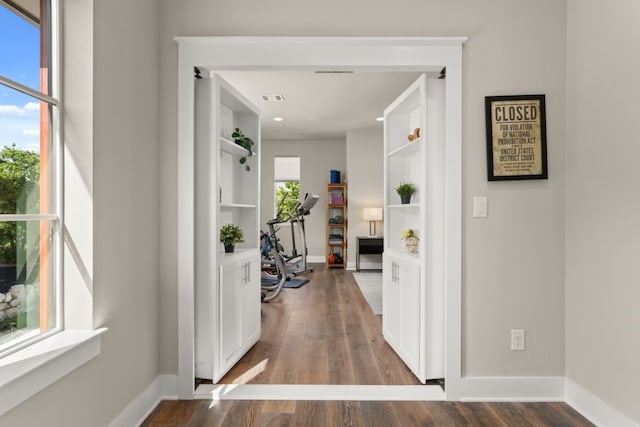 hallway featuring dark hardwood / wood-style floors