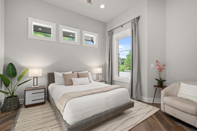 bedroom with hardwood / wood-style flooring