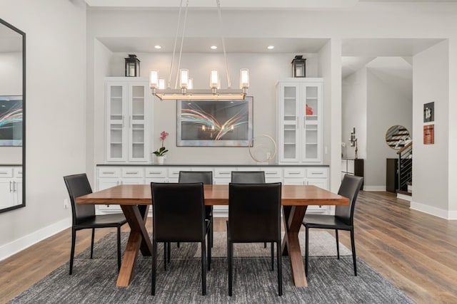 dining space with dark hardwood / wood-style floors