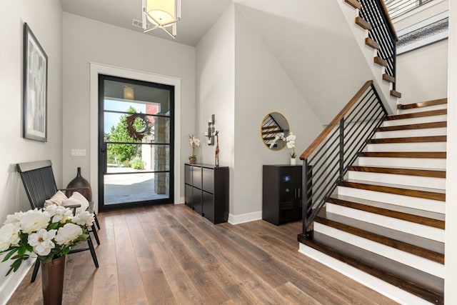 foyer entrance with dark hardwood / wood-style flooring