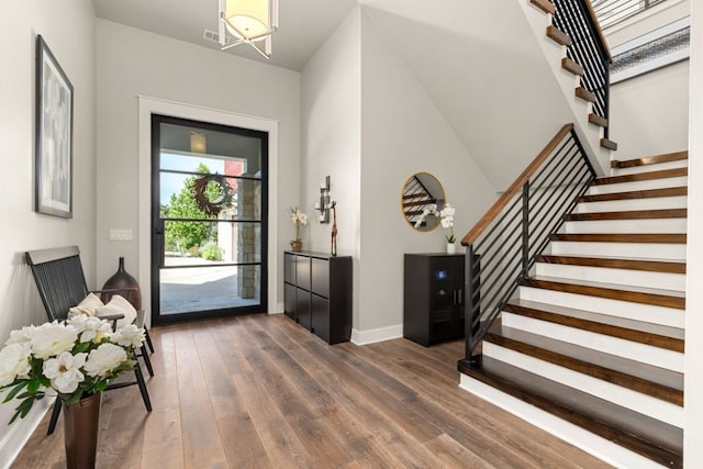 821 Laughing Dog Ct, Leander, TX 78641 - entrance foyer featuring stairway, dark wood finished floors, and a chandelier