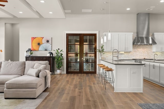 821 Laughing Dog Ct, Leander, TX 78641 - living room with wood finished floors, recessed lighting, and french doors
