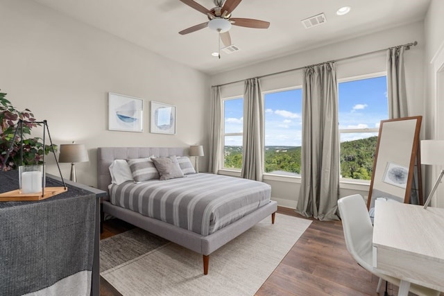 bedroom featuring dark hardwood / wood-style flooring and ceiling fan