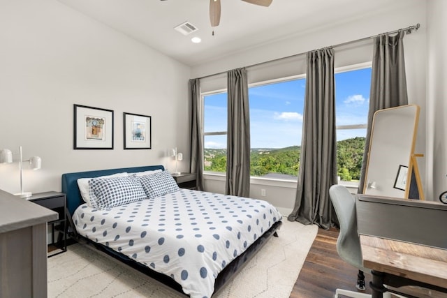 bedroom featuring hardwood / wood-style flooring and ceiling fan