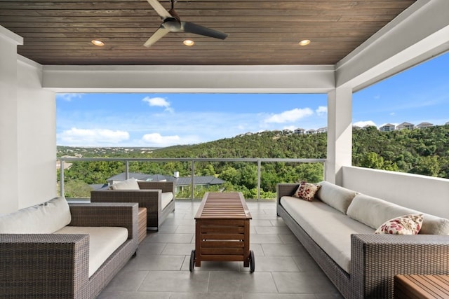 821 Laughing Dog Ct, Leander, TX 78641 - balcony with outdoor lounge area, a ceiling fan, and a forest view
