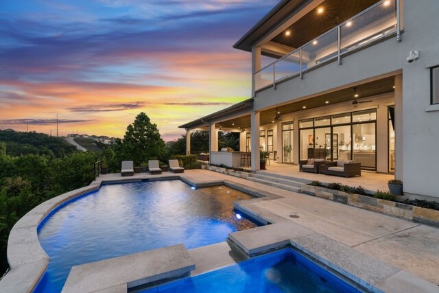 821 Laughing Dog Ct, Leander, TX 78641 - swimming pool with an outdoor hot tub, an outdoor hangout area, ceiling fan, and a patio area