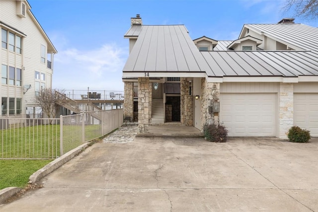 view of front of home featuring a garage and a front lawn