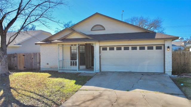 view of front of property featuring a garage and a front lawn