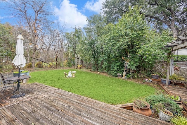 wooden terrace with a yard