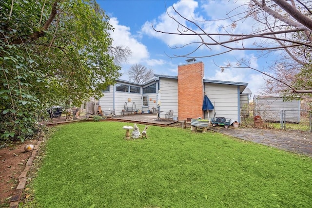 back of house with a lawn