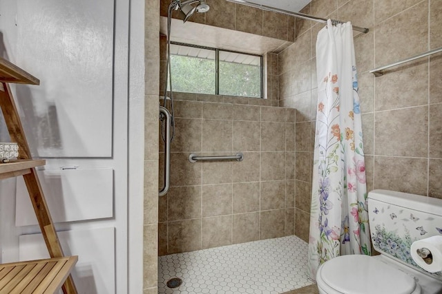 bathroom featuring toilet and walk in shower