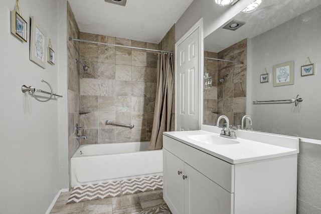 bathroom featuring vanity and shower / bath combo