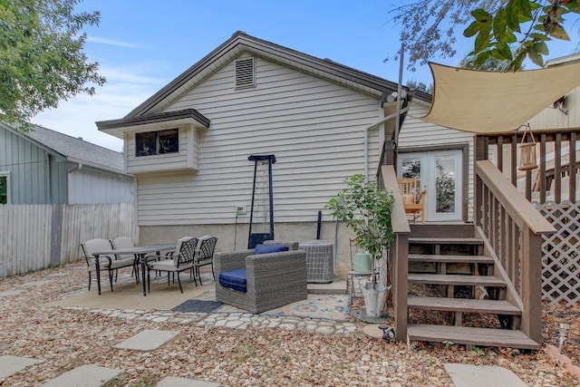 back of house featuring a patio area and central air condition unit