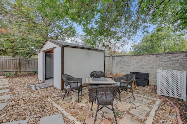 view of patio featuring a storage unit