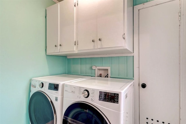 laundry area with cabinets and independent washer and dryer