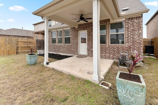 view of patio with fence and ceiling fan