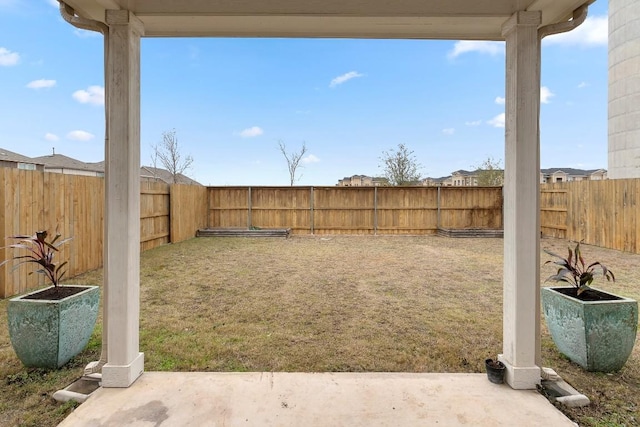 view of yard with a patio and a fenced backyard