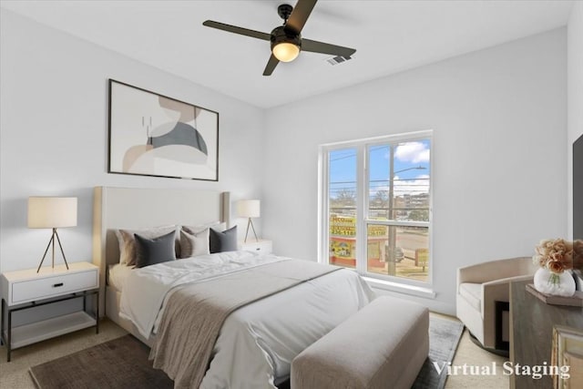 bedroom with light colored carpet and ceiling fan