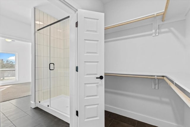 bathroom featuring tile patterned flooring and walk in shower