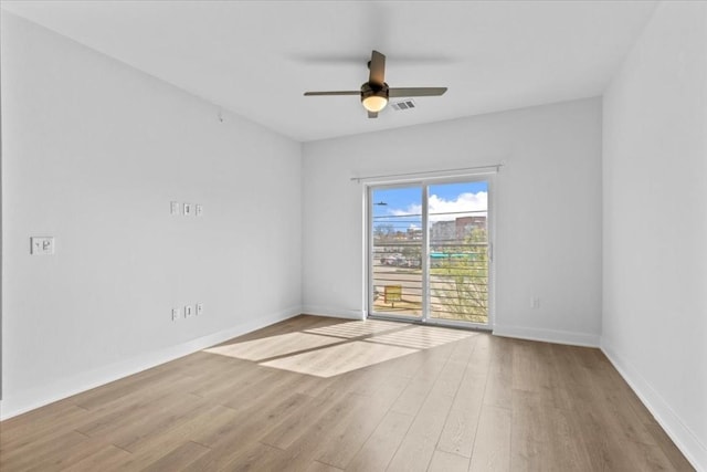 empty room featuring light hardwood / wood-style floors and ceiling fan