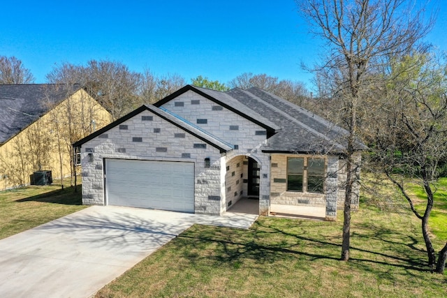 view of front facade featuring a garage, a front yard, and central air condition unit