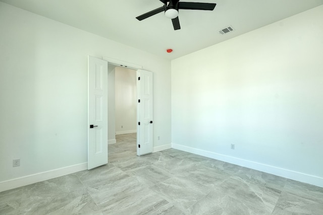 spare room with ceiling fan