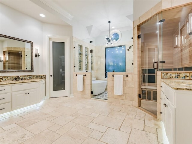 3844 Hunterwood Pt, Austin, TX 78746 - bathroom featuring two vanities, a shower stall, stone tile flooring, decorative backsplash, and a freestanding tub