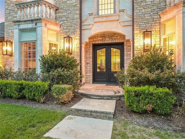 exterior entry at dusk with french doors