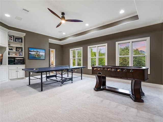 3844 Hunterwood Pt, Austin, TX 78746 - rec room with light carpet, ceiling fan, a tray ceiling, crown molding, and recessed lighting
