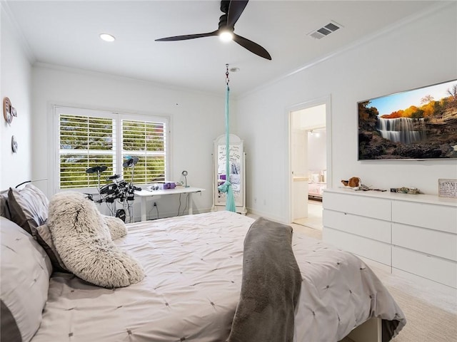 bedroom with ceiling fan, ensuite bath, and ornamental molding