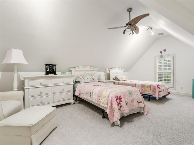 bedroom featuring ceiling fan, vaulted ceiling, and light carpet