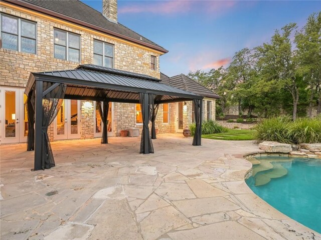 3844 Hunterwood Pt, Austin, TX 78746 - swimming pool with a gazebo, a patio, and french doors