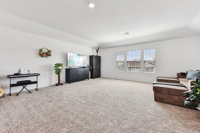 living room with lofted ceiling and carpet floors