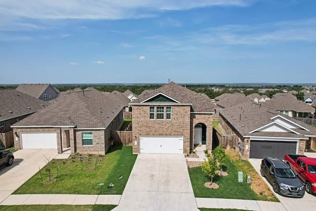 view of front of house with a garage and a front lawn