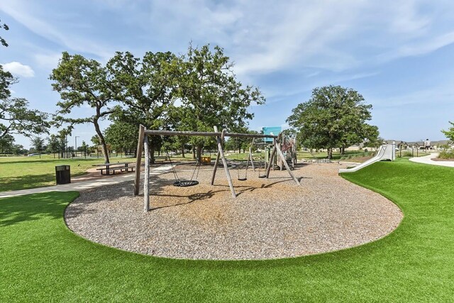 view of playground featuring a yard