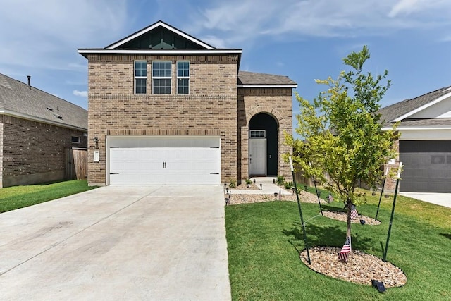 view of front of house with a garage and a front lawn