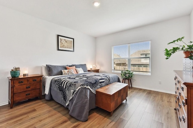 bedroom with hardwood / wood-style floors