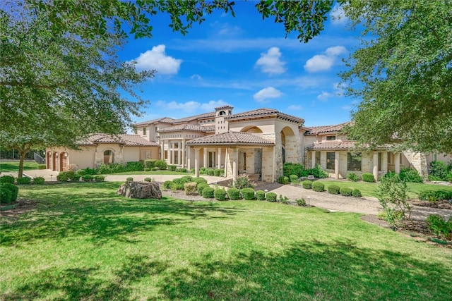 rear view of house featuring a lawn