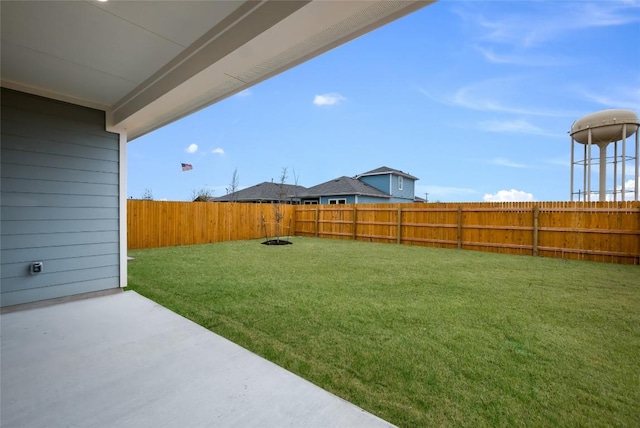 view of yard featuring a fenced backyard and a patio