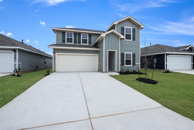 traditional home featuring an attached garage, driveway, board and batten siding, and a front yard