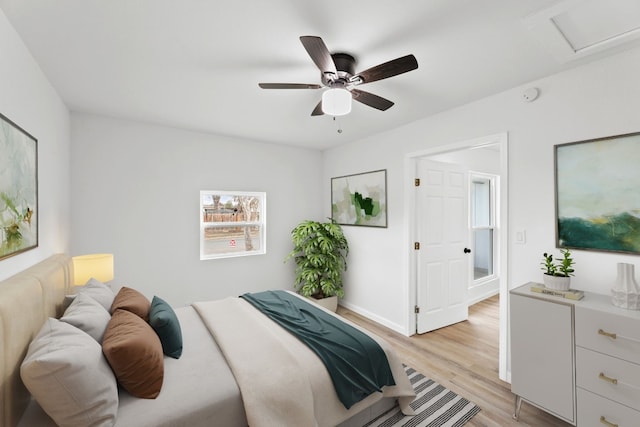 bedroom with ceiling fan and light hardwood / wood-style floors